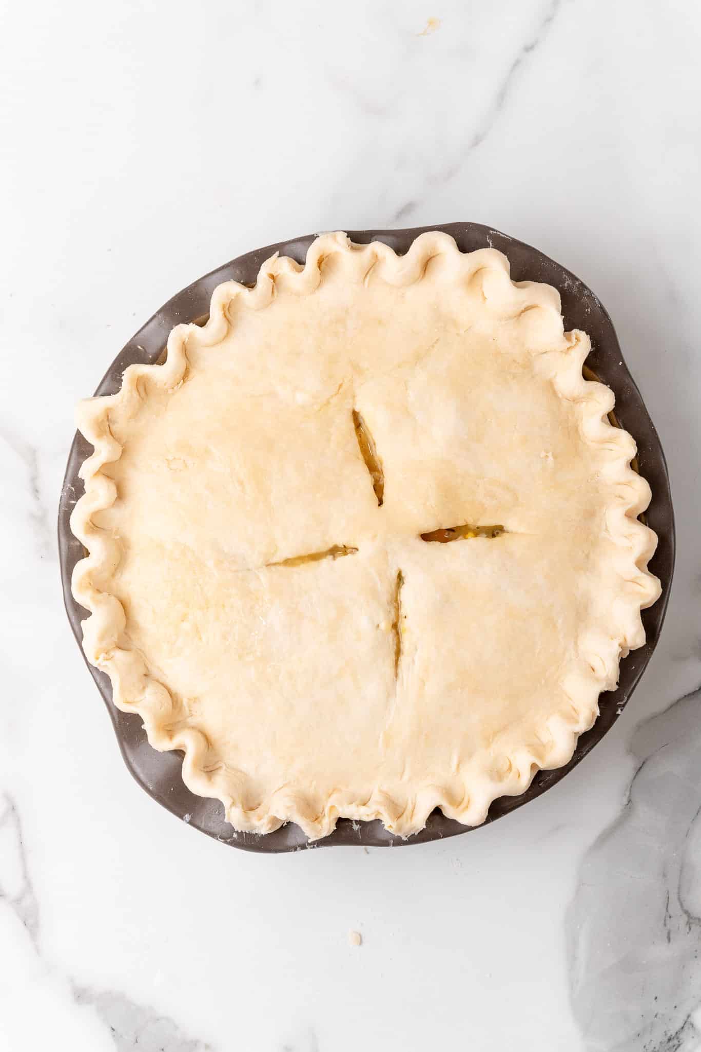 Slicing venting holes in the top crust