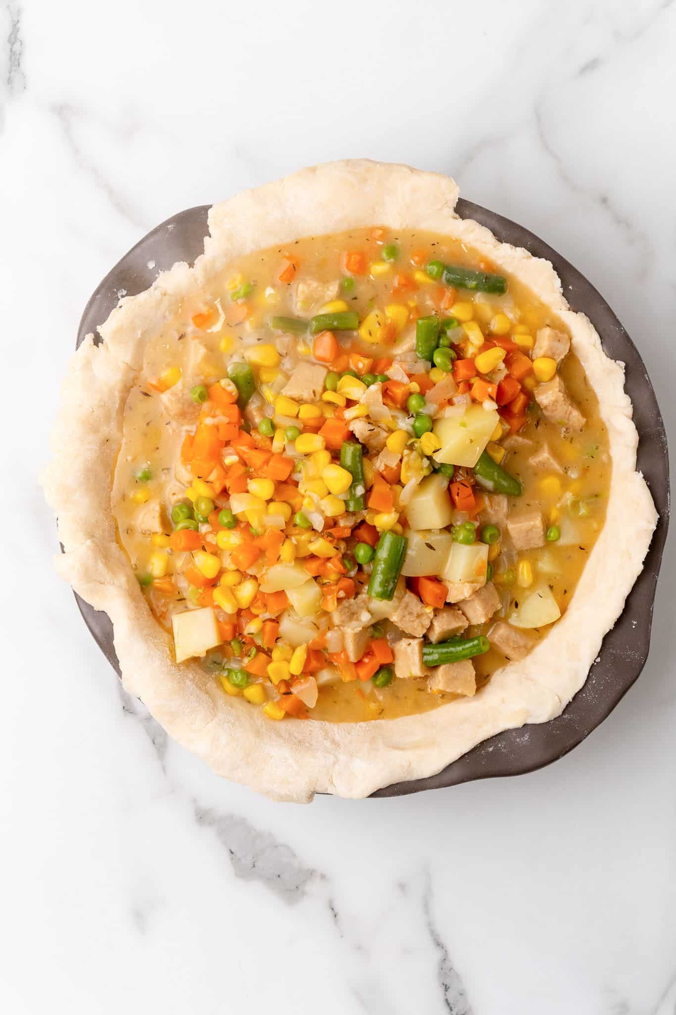 Transferring the hot filling to the pie crust